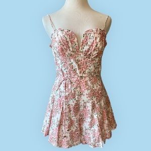 FLORAL ROMPER WITH GORGEOUS ACCENTS AND DEEP SWEETHEART NECKLINE